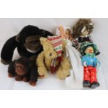 Group of six soft toys and dolls to include gorillas, teddies, clown etc