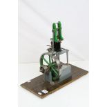 Stuart single cylinder live steam vertical engine, green and grey livery on wooden base, base