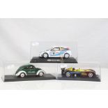 Three cased slot cars to include Pink-Kar Polizei, Scalextric Ford Focus WRC and Spanish Ford