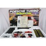 Boxed Scalextric C583 Porsche Turbo Racing Set with both slot cars, tear to box side, plus a box