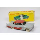 Boxed French Dinky 24D Plymouth Belvedere diecast model with grey body and red roof, cream tyres,