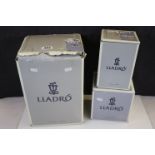Three Boxed Lladro Animals including Poodle 06337, White Swan 06175 and Dolphins ' A Swimming Lesson