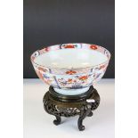 Japanese Porcelain Imari Bowl, 22.5cms diameter together with a Carved Wooden Stand