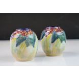 Pair of Royal Doulton Frank Brangwyn Small Globular Vases decorated with Flowers and Leaves,