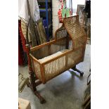 Early 19th century English mahogany and cane frame rocking cradle, 103cm long