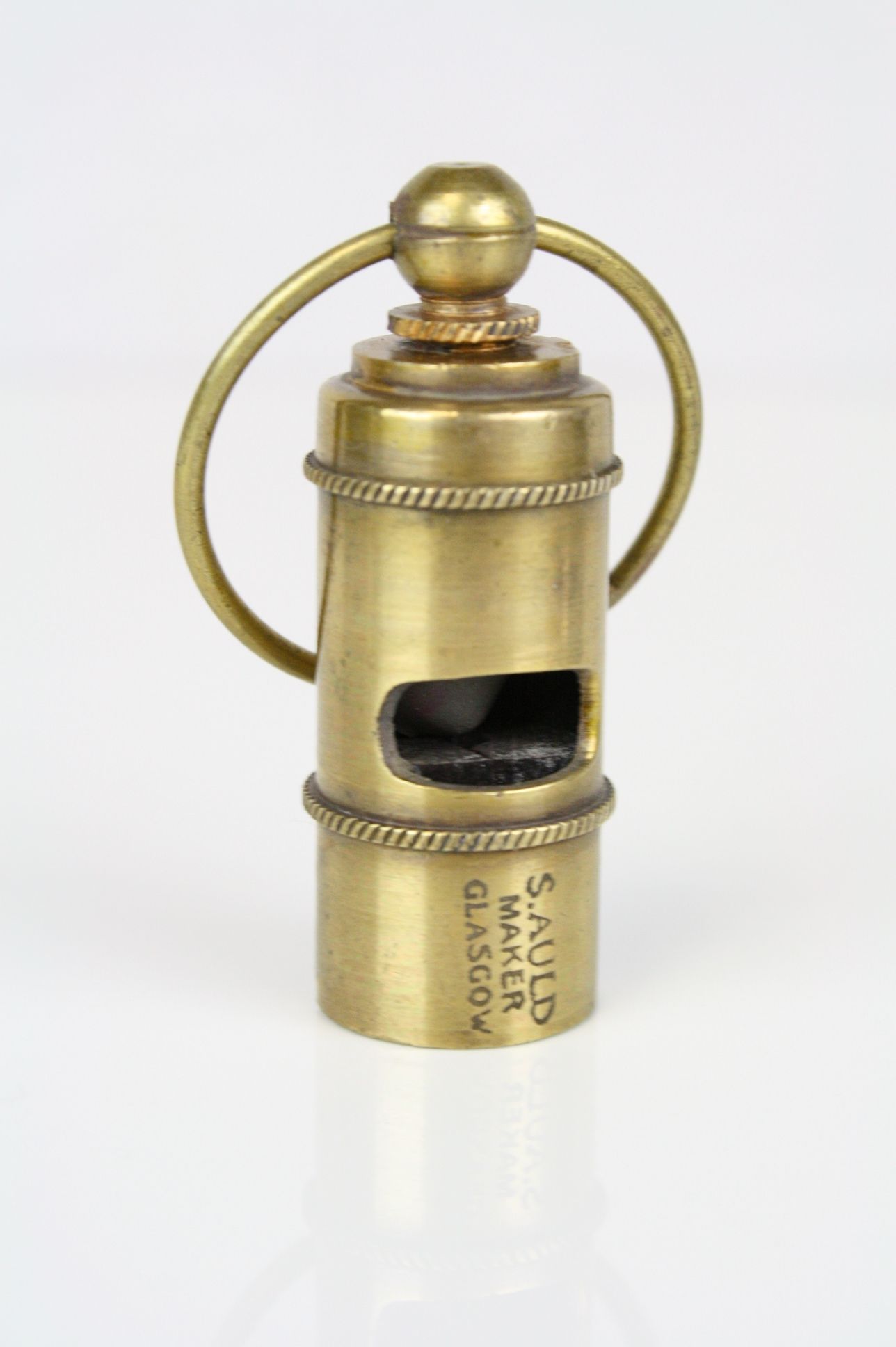 Brass cased whistle stamped Titanic