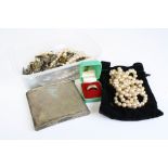 A quantity of costume jewellery to include two albert chains, brooches and necklaces.
