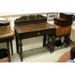 Late 19th century Oak Side Table, the upstand and single drawer heavily carved including Lion Face