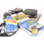 A collection of vintage electronic items to include Sony walkman, calculators and a Sony discman.