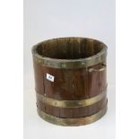 A Georgian style brass bound twin handled barrel, diameter 34cm, height 30cm