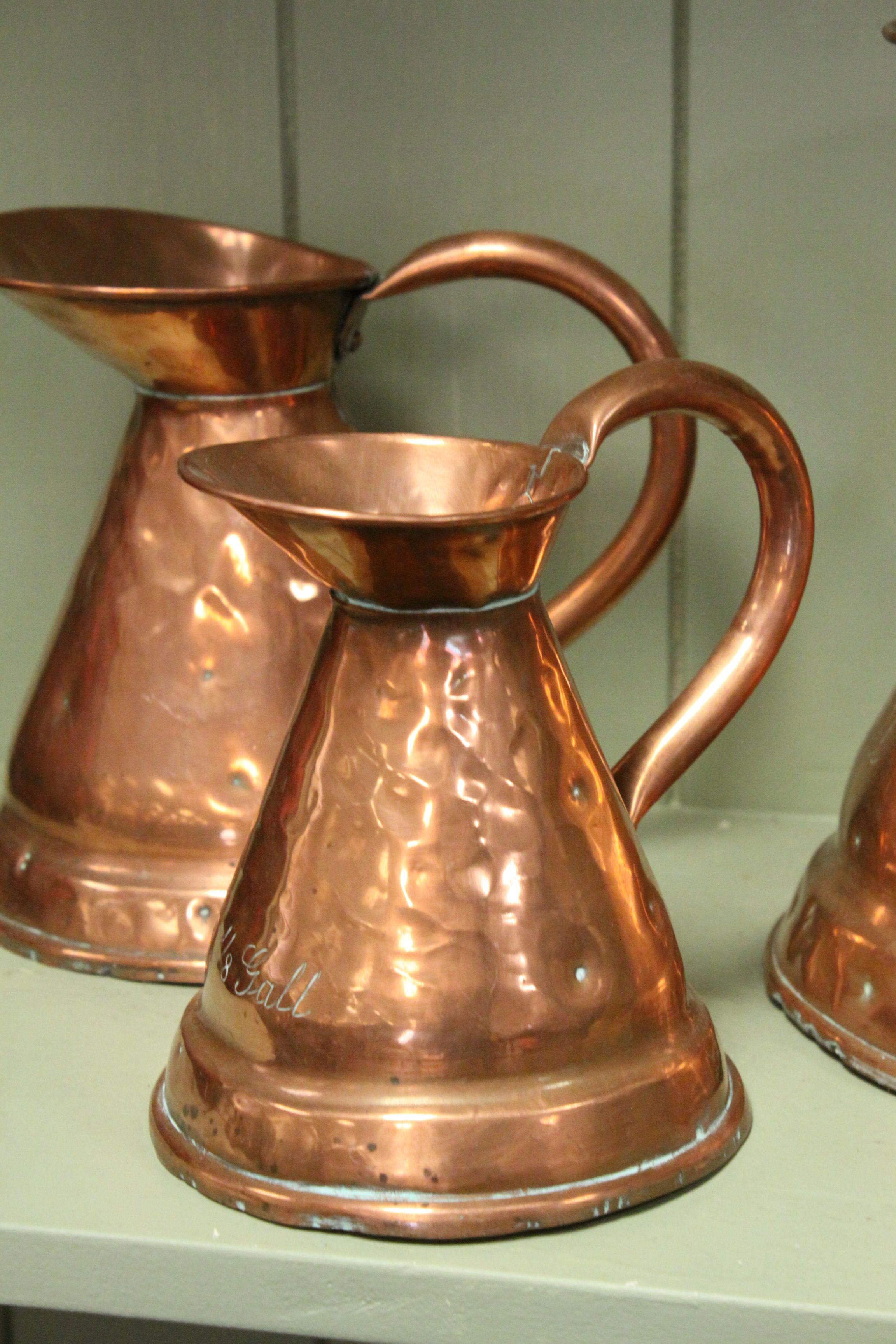 Three Antique Copper Graduating Measuring Jugs marked 1/2 Gall, 1/4 Gall and 1/8 Gall - Image 2 of 4