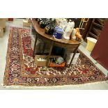 Large Wool Red Ground Rug with Geometric Pattern within Border, approx. 325cms x 250cms