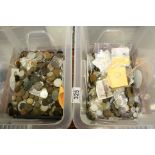 Two boxes containing a large selection of coins, tokens and banknotes to include foreign and British
