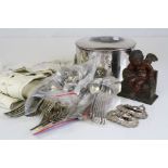 A quantity of silver plated items to include cutlery, bottle labels and a tea caddy.