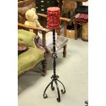 Wrought Iron Candle Stand on Twisted Stem together with a Large Moulded Red Candle, total height