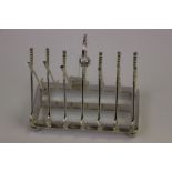 Silver plated toast rack in the form of golf clubs