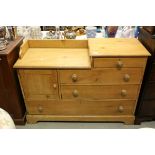 Victorian pine chest of four drawers and cupboard on plinth base and knob handles