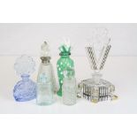 A collection of vintage glass and ceramic scent bottles