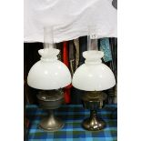 Pair of Early 20th century Brass Oil Lamps with Opaque Glass Shades and Chimneys, each 61cms high