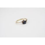 Yellow gold pear shaped sapphire and diamond ring