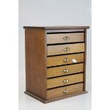 Vintage six drawer collectors cabinet with fitted brass handles, standing approx. 35cm