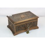 A carved wooden box with various contents to include watches, penknife, pocket watch, cigarette