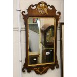 19th century Mahogany Fretwork Mirror, the pierced crest carved with a Ho Ho Bird, 79cms x 44cms