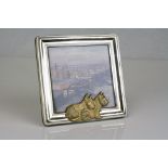 A 925 sterling silver photograph frame with dog decoration.
