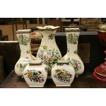Royal Doulton - Two Pairs of Vases and a further vase, all decorated in the same floral pattern on