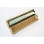 A pair of oriental mother of pearl chopsticks in wooden box