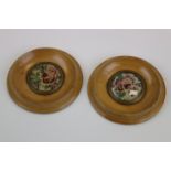 Pair of a circular wooden miniatures depicting needlepoint