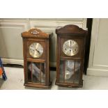 Two Early 20th century Oak Cased Eight Day Hanging Wall Clocks, both with Gilt Dials and Arabic
