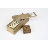 A set of bone double six dominoes together with a Tunbridge ware stamp box.