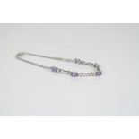 A 14ct white gold bracelet set with diamonds and tanzanite.