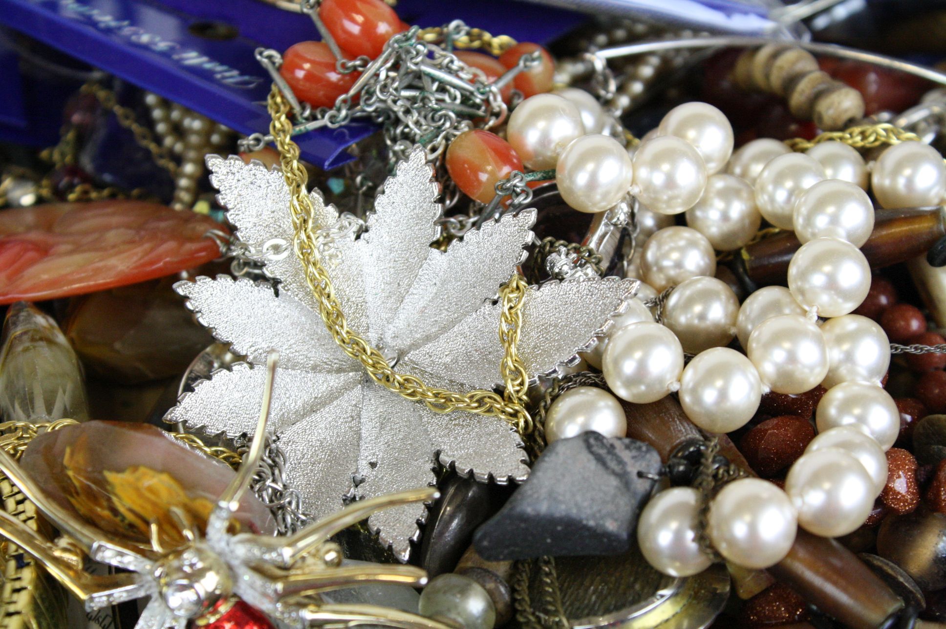 A box of mixed costume jewellery to include brooches and necklaces together with a selection of - Image 2 of 5