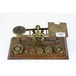 Set of antique brass postal scales complete with weights