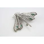Silver bug brooch set with emerald style cabochons