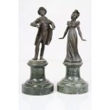 Two mounted bronze figures of a Victorian lady and gentleman. Height is approx 16cm.