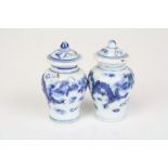 A pair of miniature Chinese blue and white lidded jars. approx 5.5cm in height.