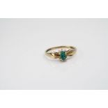 Yellow gold emerald and diamond ring