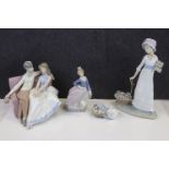 Boxed Lladro Figurine with Parasol no. 5.212 together with a Lladro Figure Group of Couple sat on