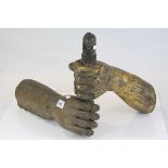 An unusual carved giltwood wall mounted candle holder in the form of an arm with a clenched fist,