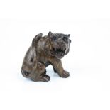 Carved wooden netsuke in the form of a tiger