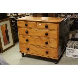 19th century Pine Chest of Two Short over Three Long Drawers with Wooden Handles and raised on