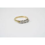A four stone 18ct gold diamond ring. (UK Size Q).