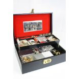 A jewellery box containing a quantity of mainly vintage costume jewellery to include necklaces and