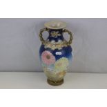 Japanese two handled vase decorated with chrysanthemums, signed to base
