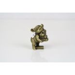 Miniature bronze/brass pig depicting the fable little pig with bricks