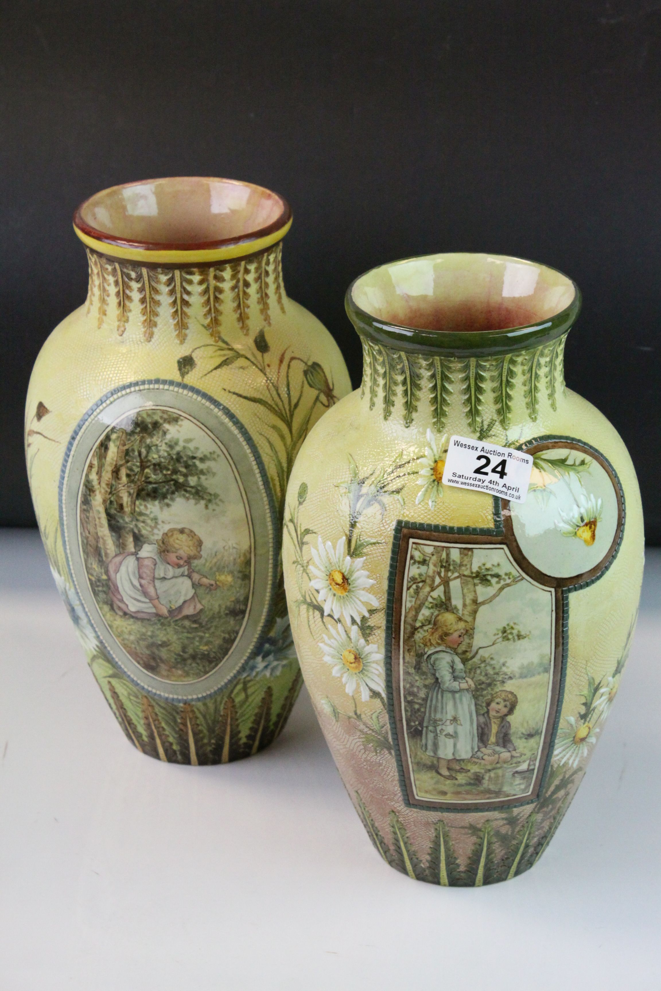 Two similar Doulton Lambeth Faience Ware Vases, each with hand decorated with a panel depicting