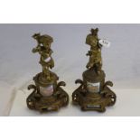 Pair of 19th century French Gilt and Porcelain Mounted Garnitures in the form of Cherubs stood on